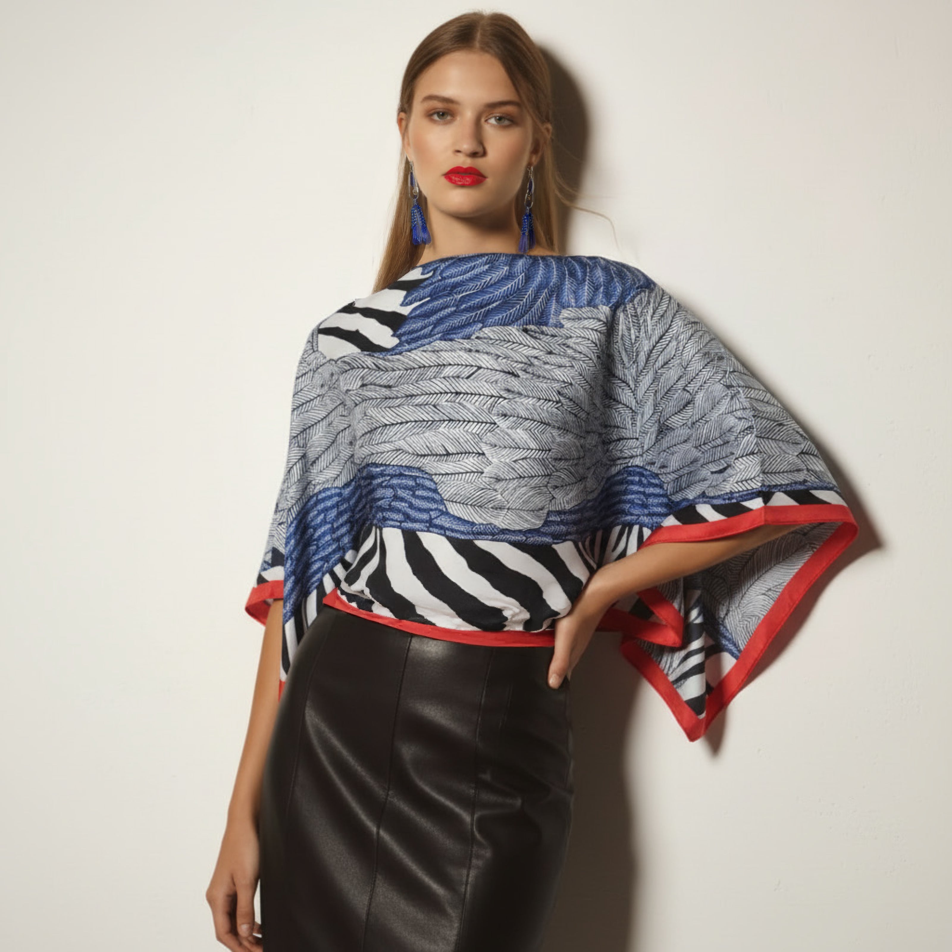 Feather Style Poncho With Red Trim