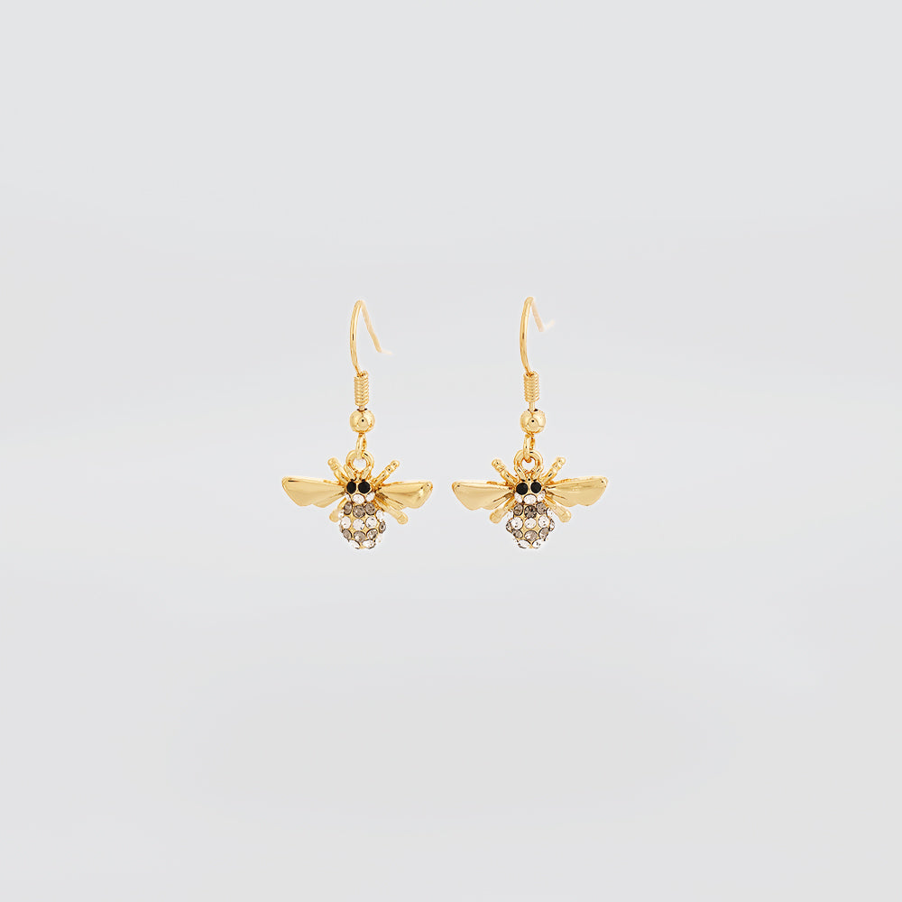 Gold bee-shaped earrings with gemstones on a light gray background