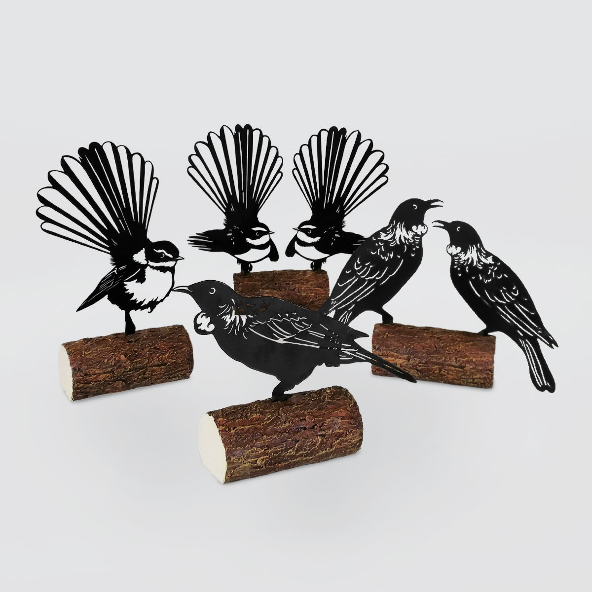 Birds Sitting On Logs Scuplture