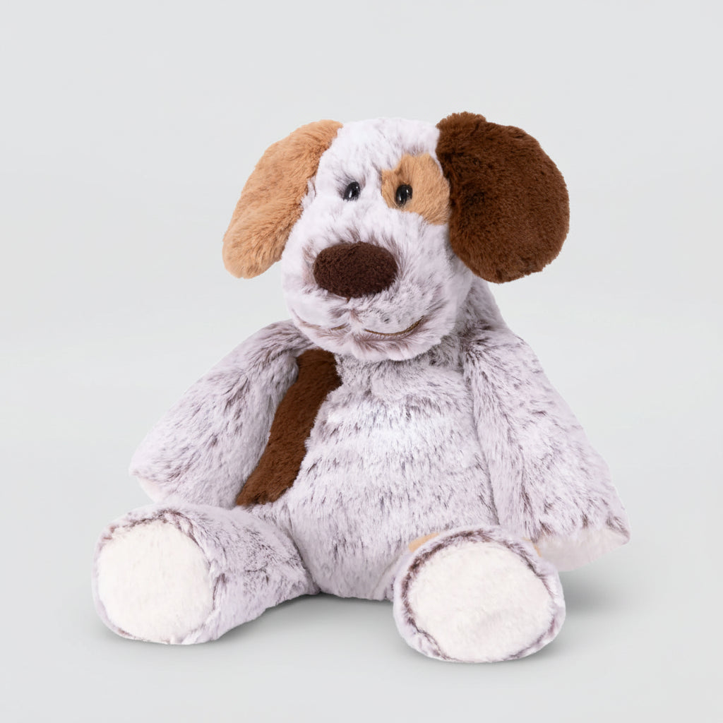 Plush dog toy with brown and white fur on a light gray background