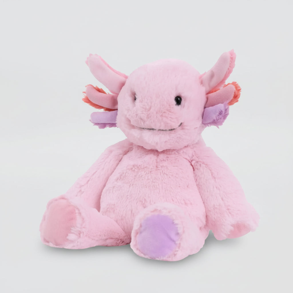 Pink plush axolotl toy on a light gray background