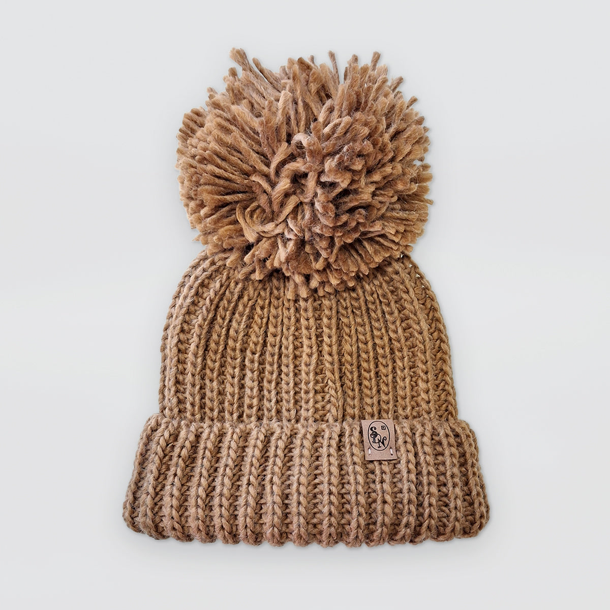 Knitted Hats With Pompoms
