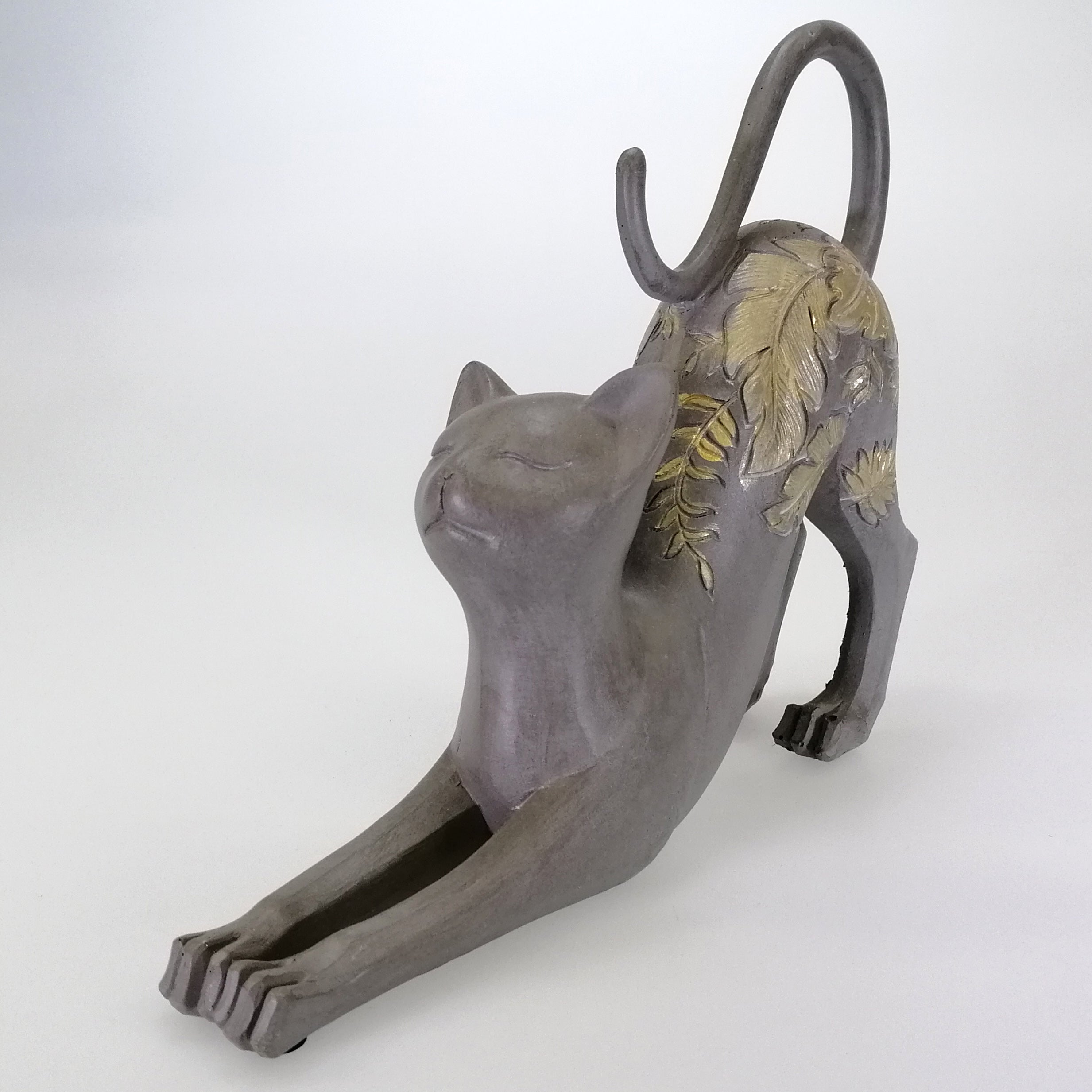 Stretching Cat Figure with Gold Accents